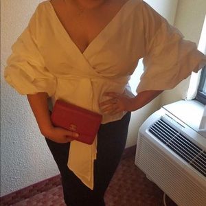 White wrap top with draped layered sleeves 3x plus can be worn by a 1x and 2x
